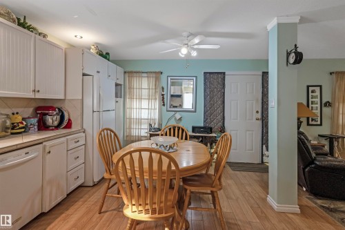 Dining room featuring light wood finished floors and ceiling fan - 218 58532 Range Road 113, Rural St. Paul County, AB - Indoor Photo Showing Dining Room