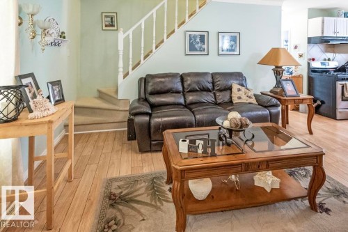 Living area with light wood-style flooring and stairs - 218 58532 Range Road 113, Rural St. Paul County, AB - Indoor Photo Showing Living Room