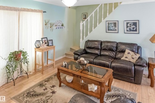 Living area with wood-type flooring and stairs - 218 58532 Range Road 113, Rural St. Paul County, AB - Indoor Photo Showing Living Room