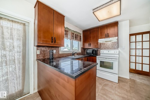 6308 144A Avenue, Edmonton, AB - Indoor Photo Showing Kitchen With Double Sink