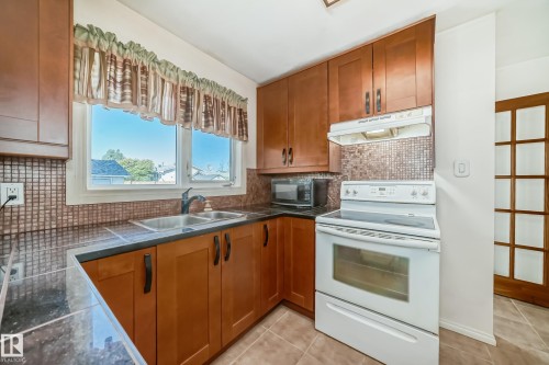 6308 144A Avenue, Edmonton, AB - Indoor Photo Showing Kitchen With Double Sink