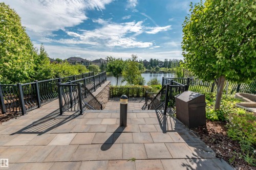 View of patio / terrace with a water view - 140 6079 Maynard Way, Edmonton, AB - Outdoor