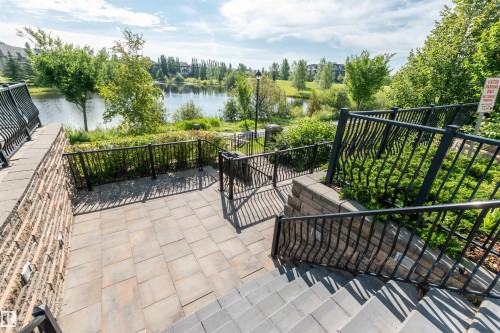 View of patio / terrace featuring a water view - 140 6079 Maynard Way, Edmonton, AB - Outdoor