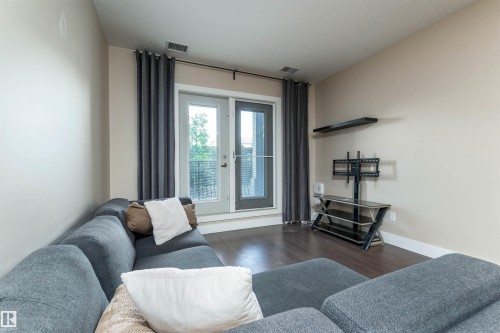 140 6079 Maynard Way, Edmonton, AB - Indoor Photo Showing Living Room
