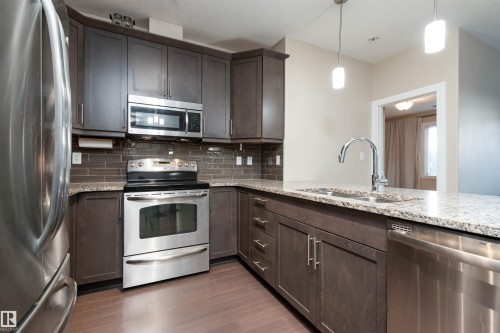 140 6079 Maynard Way, Edmonton, AB - Indoor Photo Showing Kitchen With Double Sink With Upgraded Kitchen