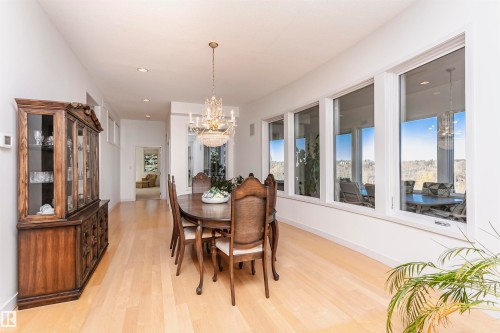 Dining space with a chandelier, light wood-type flooring, and recessed lighting - 19103 Ellerslie Road Sw, Edmonton, AB - Indoor Photo Showing Dining Room