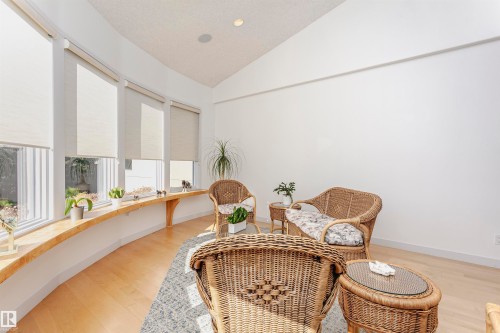 Sitting room with vaulted ceiling and light wood-style flooring - 19103 Ellerslie Road Sw, Edmonton, AB - Indoor