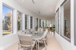 Sunroom / solarium featuring baseboards and recessed lighting - 