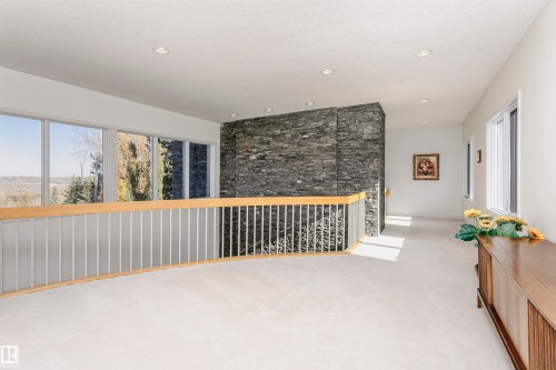 Spare room with healthy amount of natural light, light colored carpet, and recessed lighting - 19103 Ellerslie Road Sw, Edmonton, AB - Indoor Photo Showing Other Room