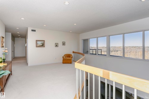 Hall with recessed lighting and light colored carpet - 19103 Ellerslie Road Sw, Edmonton, AB - Indoor Photo Showing Other Room