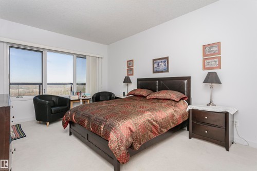 Carpeted bedroom featuring baseboards - 19103 Ellerslie Road Sw, Edmonton, AB - Indoor Photo Showing Bedroom