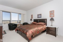 Carpeted bedroom featuring baseboards - 