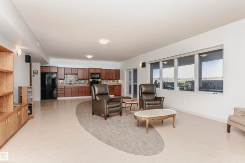 Living area with light floors - 19103 Ellerslie Road Sw, Edmonton, AB - Indoor