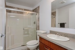 Bathroom with a stall shower and vanity - 