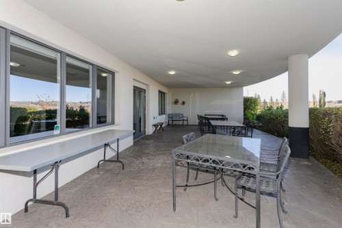 View of patio / terrace featuring outdoor dining space - 19103 Ellerslie Road Sw, Edmonton, AB - Outdoor With Deck Patio Veranda With Exterior