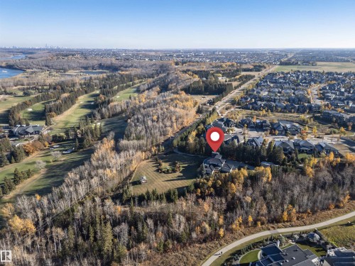 Aerial overview of property's location with nearby suburban area and a nearby body of water - 19103 Ellerslie Road Sw, Edmonton, AB - Outdoor With View
