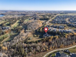 Aerial overview of property's location with nearby suburban area and a nearby body of water - 