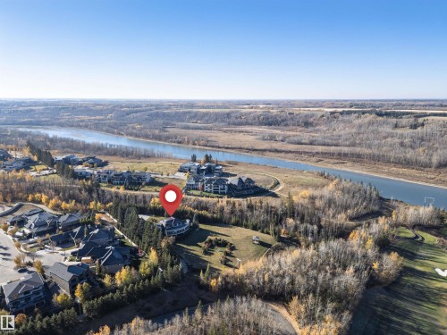 Aerial view of property and surrounding area with a nearby body of water - 19103 Ellerslie Road Sw, Edmonton, AB - Outdoor With View