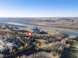 Aerial view of property and surrounding area with a nearby body of water - 
