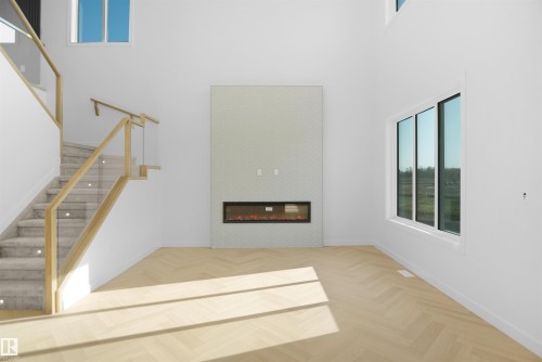 11 Trill Point(E), Spruce Grove, AB - Indoor Photo Showing Other Room With Fireplace