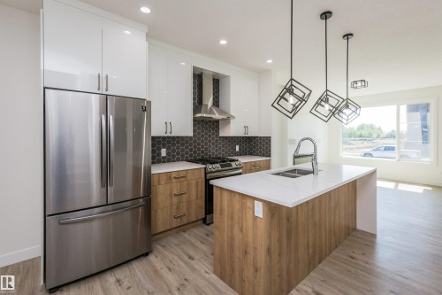 Main 8082 Kiriak Link, Edmonton, AB - Indoor Photo Showing Kitchen With Stainless Steel Kitchen With Double Sink With Upgraded Kitchen