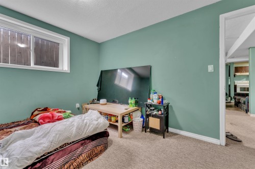 3307 24 Av Nw, Edmonton, AB - Indoor Photo Showing Bedroom