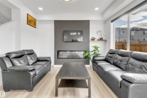 1424 15 Street, Edmonton, AB - Indoor Photo Showing Living Room With Fireplace