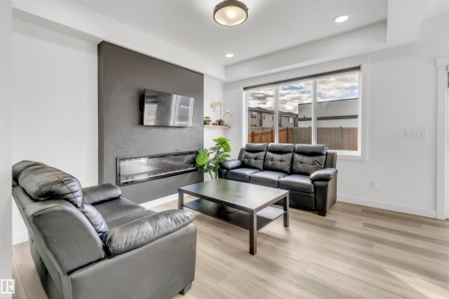 1424 15 Street, Edmonton, AB - Indoor Photo Showing Living Room With Fireplace