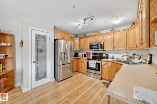 202 9995 93 Avenue, Fort Saskatchewan, AB - Indoor Photo Showing Kitchen With Double Sink