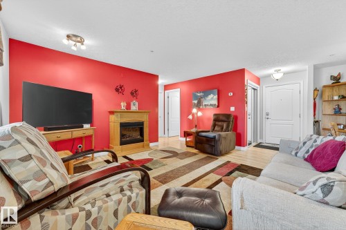 202 9995 93 Avenue, Fort Saskatchewan, AB - Indoor Photo Showing Living Room With Fireplace