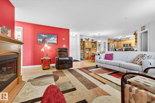 202 9995 93 Avenue, Fort Saskatchewan, AB - Indoor Photo Showing Living Room With Fireplace
