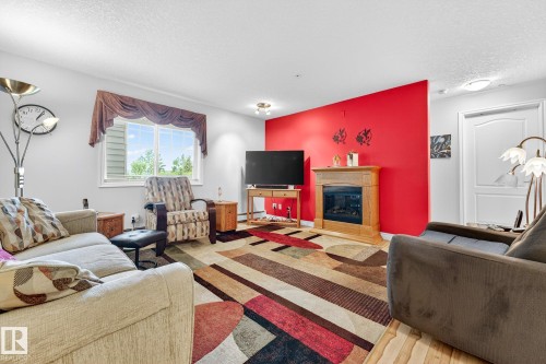 202 9995 93 Avenue, Fort Saskatchewan, AB - Indoor Photo Showing Living Room With Fireplace