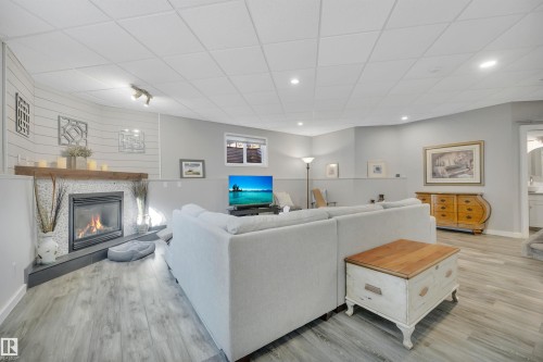 254 Pipestone Close, Millet, AB - Indoor Photo Showing Living Room With Fireplace