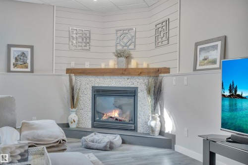 254 Pipestone Close, Millet, AB - Indoor Photo Showing Living Room With Fireplace