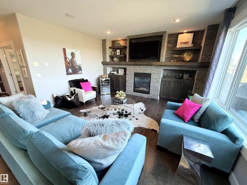 1186 Genesis Lake Boulevard, Stony Plain, AB - Indoor Photo Showing Living Room With Fireplace