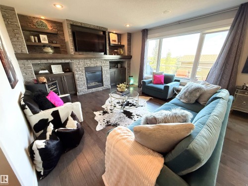 1186 Genesis Lake Boulevard, Stony Plain, AB - Indoor Photo Showing Living Room With Fireplace
