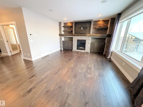 1186 Genesis Lake Boulevard, Stony Plain, AB - Indoor Photo Showing Living Room With Fireplace
