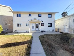 Rear view of house featuring a patio area, a gate, and entry steps - 