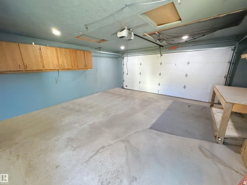 Garage with a garage door opener - 10226 152 Street, Edmonton, AB - Indoor Photo Showing Garage
