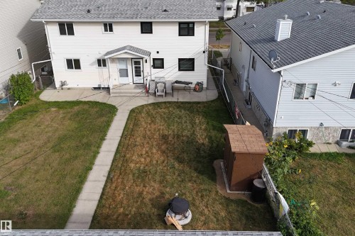 Back of house featuring a patio and a shingled roof - 10226 152 Street, Edmonton, AB - Outdoor