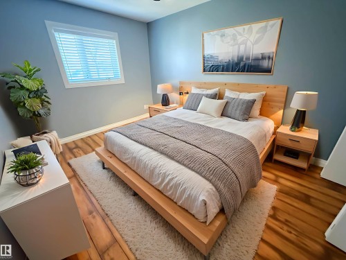 Bedroom with wood finished floors - 10226 152 Street, Edmonton, AB - Indoor Photo Showing Bedroom