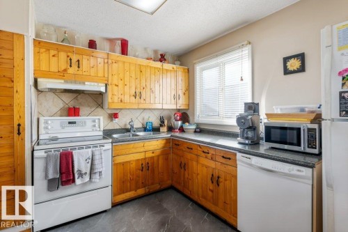 13003 129 Avenue, Edmonton, AB - Indoor Photo Showing Kitchen With Double Sink