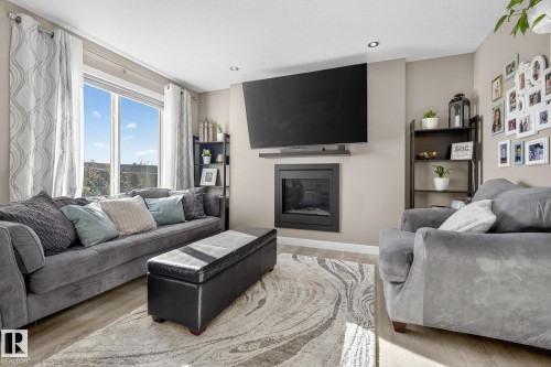 7139 Cardinal Way, Edmonton, AB - Indoor Photo Showing Living Room With Fireplace
