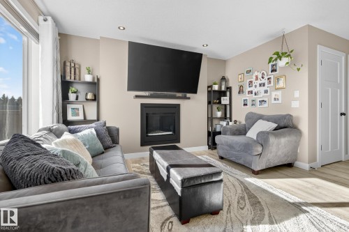 7139 Cardinal Way, Edmonton, AB - Indoor Photo Showing Living Room With Fireplace
