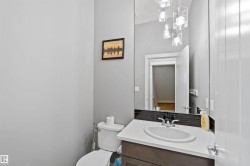 Bathroom featuring vanity and toilet - 