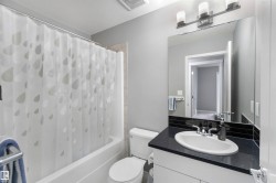 Main bathroom with vanity and shower / bath combo - 