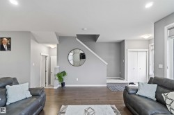 Living room featuring wood finished floors and recessed lighting - 