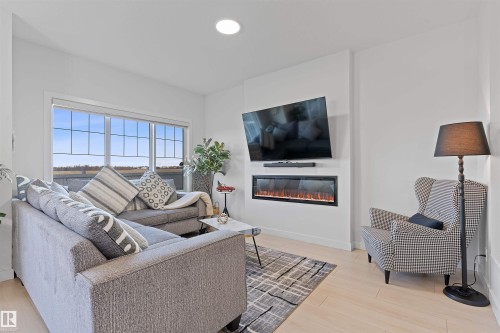 3427 Craig Landing, Edmonton, AB - Indoor Photo Showing Living Room With Fireplace