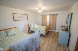 Bedroom featuring wood finished floors - 