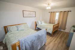 Bedroom featuring wood finished floors - 